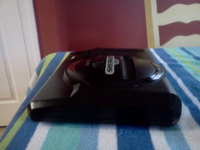My Personal Sega Genesis, the one I have had since childhood, completely cleaned  inside and out, all solder reflowed, all rusty things replaced in 100% beautiful condition.  And most the finish and scratch buffing was done with turtle wax, comments if you got'em!~